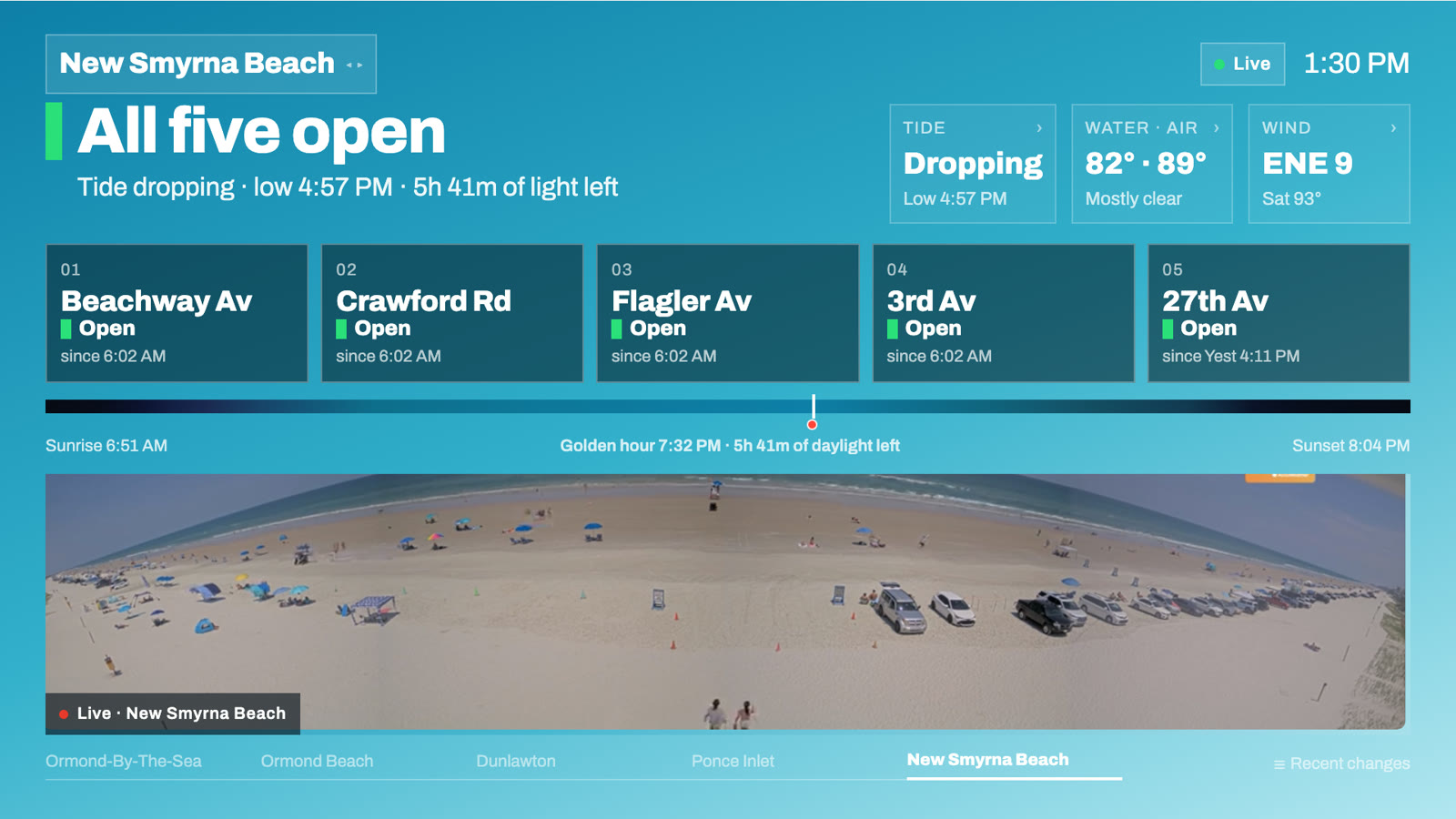 Apple TV app showing New Smyrna Beach ramps open, tide and weather, daylight timeline, and a live beach cam
